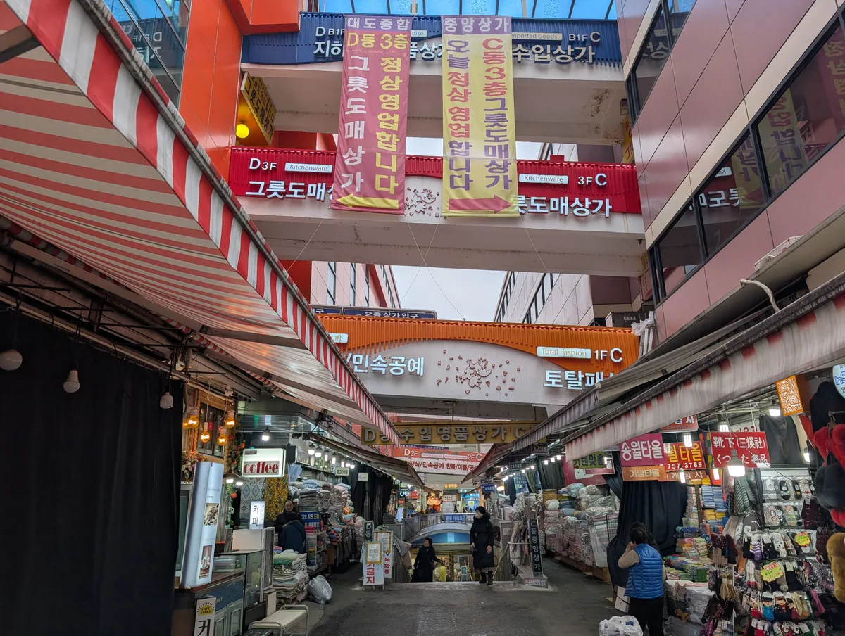 Shops and Korean signs inside Dongdaemun Shopping Complex