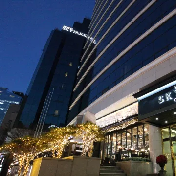 Hotel Skypark Central Myeongdong entrance illuminated at night