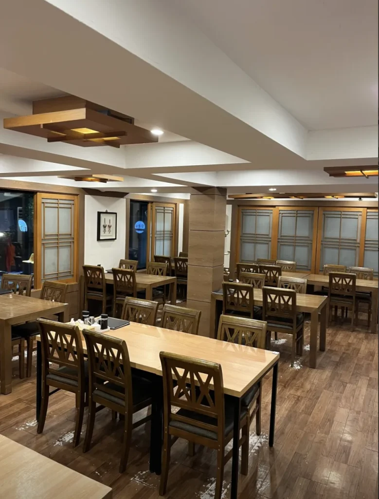 Hwangsaengga dining room with wooden tables and chairs