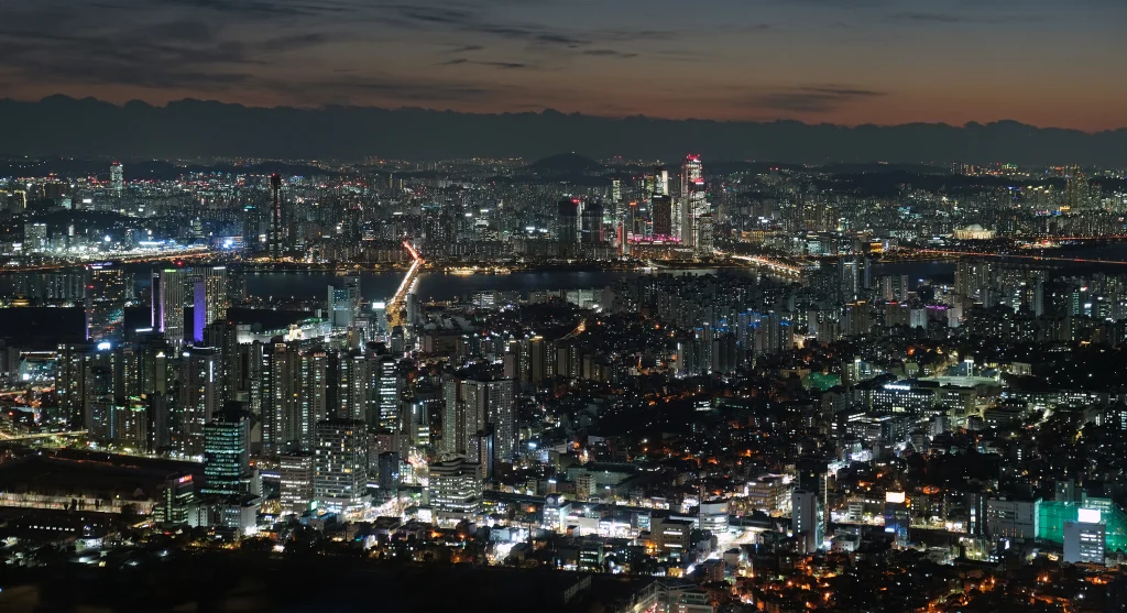 Seoul skyline and the Han River illuminated at night as seen from N Seoul Tower